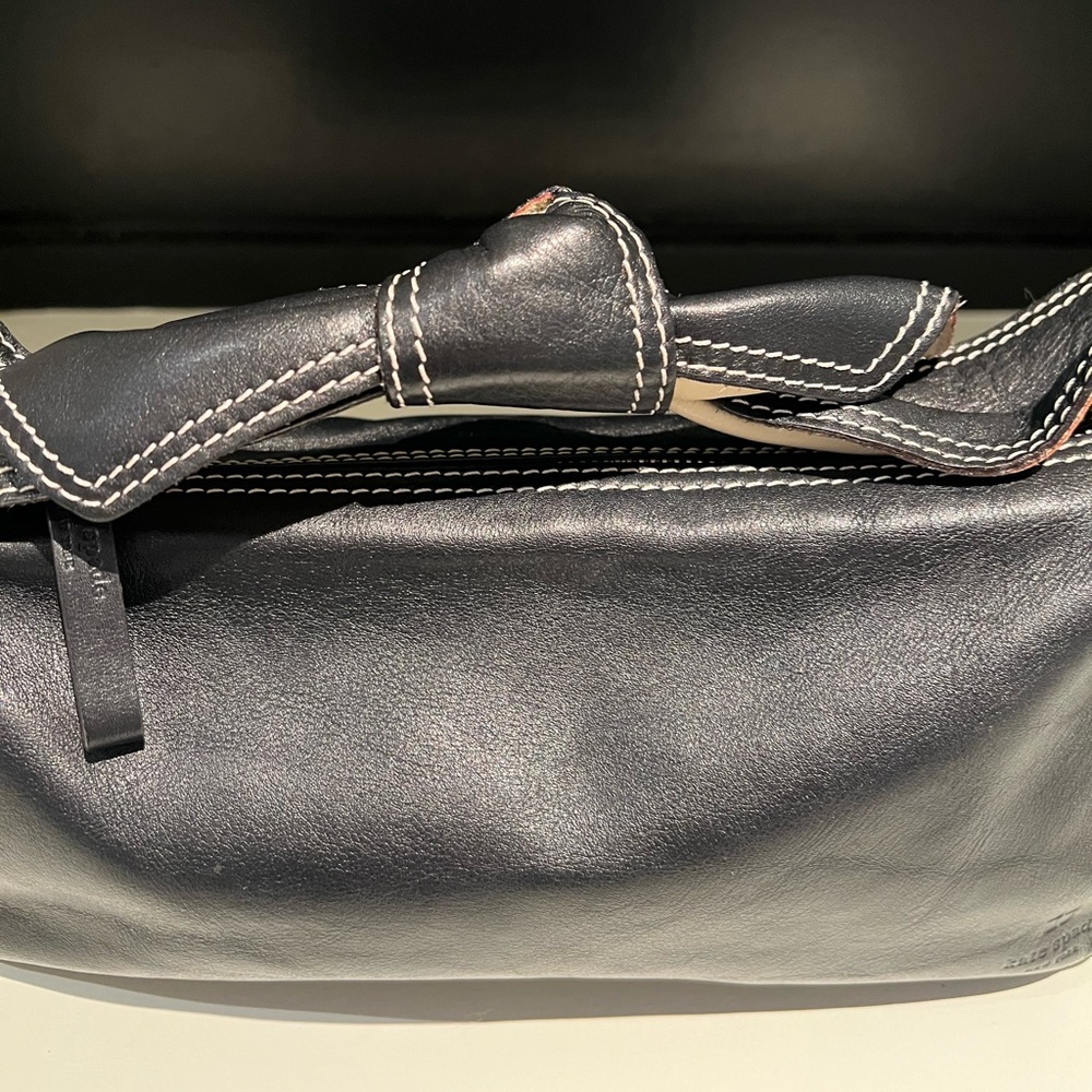 Kate Spade black leather “bow” bag.